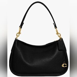 Coach Cary crossbody bag black with gold hardware.